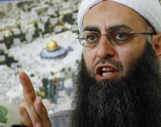 Sunni Muslim Salafist leader al-Assir speaks about clashes between Alawite supporters of Syrian President Bashar al-Assad and Sunni Muslim fighters during a news conference at his office in Sidon, southern Lebanon
