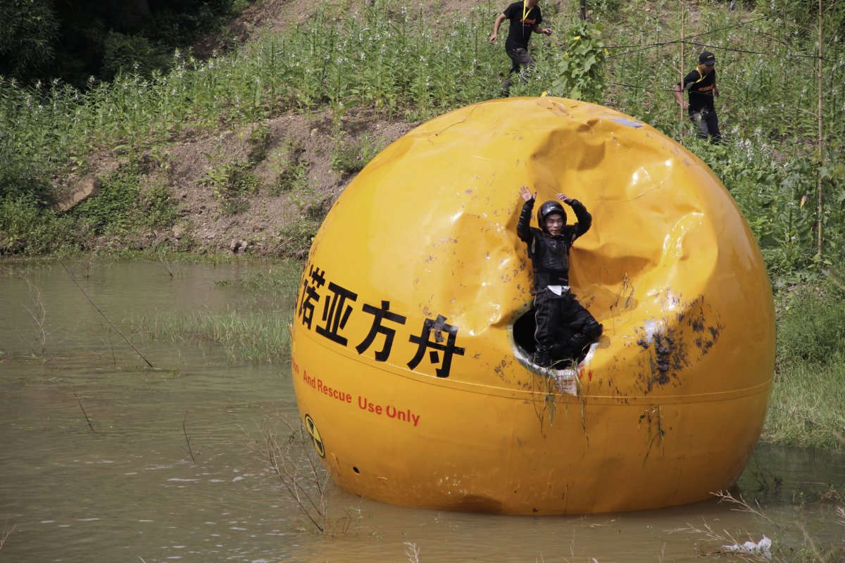 a-chinese-inventor-yang-zongfu-celebrates-on-his-six-ton-5443-kg-ball-container-named-noahs-ark-of-china-after-he-succeeds-in-a-series-of-tests-of-the-vessel-in-yiwu-zhejiang-province