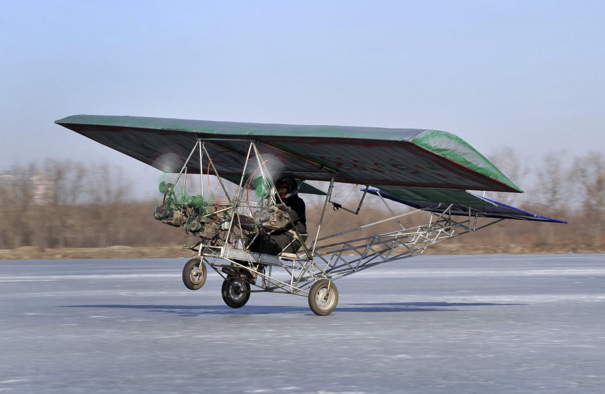 ding-shilu-an-automobile-mechanic-carries-out-a-test-flight-for-his-self-made-aircraft-at-a-frozen-reservoir-in-shenyang-liaoning-province-february-25-2011