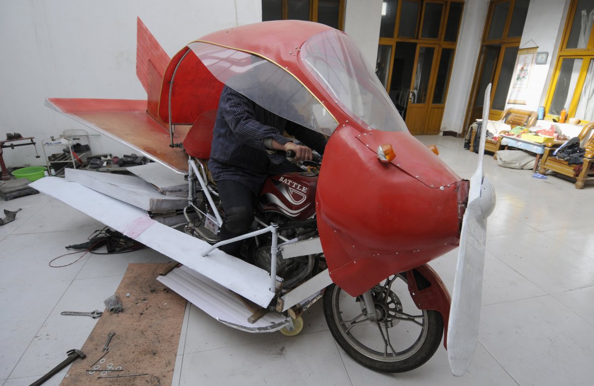 zhang-xuelin-sits-inside-his-self-made-aircraft-at-his-home-before-its-test-flight-in-jinan-shandong-province-november-28-2012