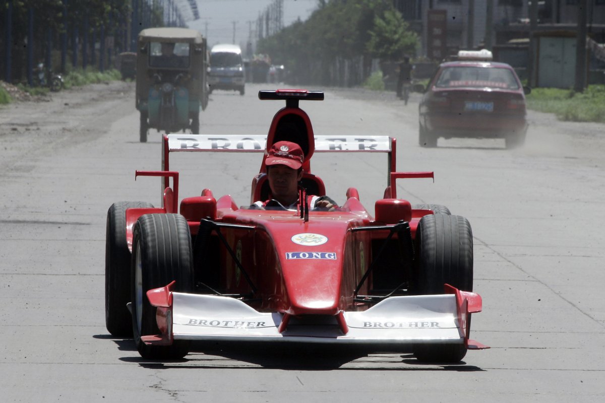 zhao-xiuguo-drives-a-homemade-model-of-formula-one-car-in-tangshan-hebei-province-some-180km-113-miles-east-of-beijing-july-21-2006