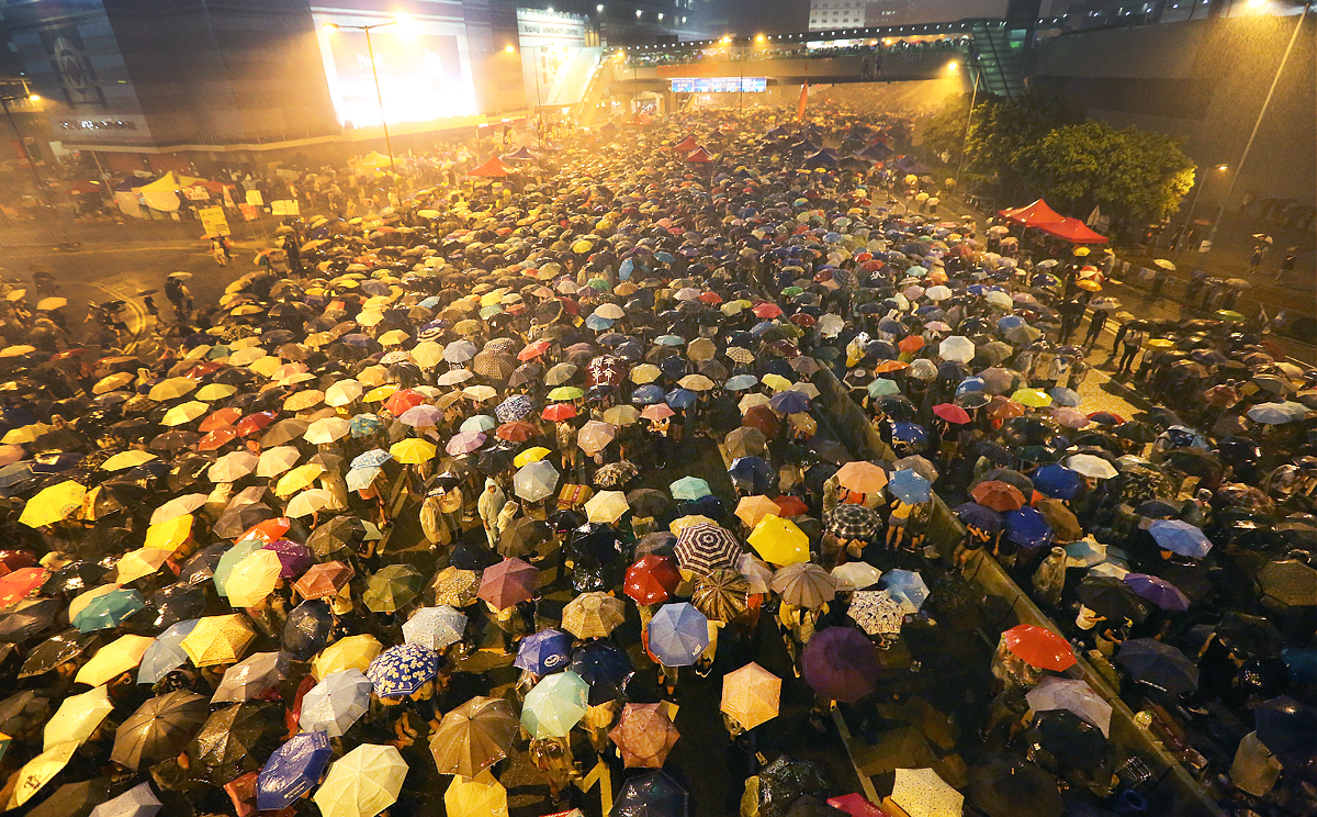 Protesters in the rain in Admiralty as "Occupy Central with Love and Peace" (OCLP) movement organizer Benny Tai Yiu-ting announced "Occupy Central" launch officially on Sep28. 30SEP14