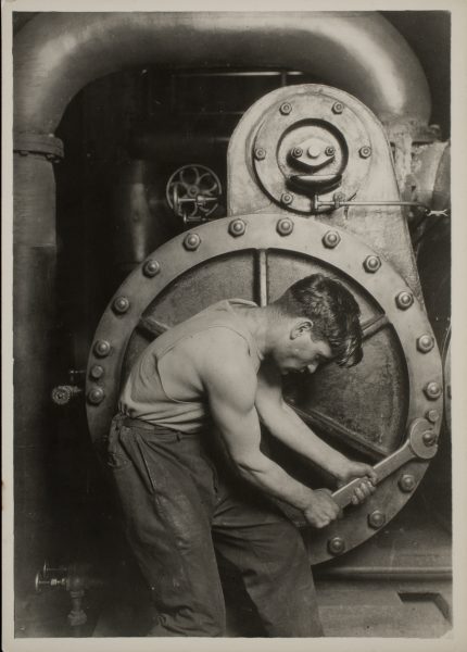 Mechanic at steam pump in Electric power house.