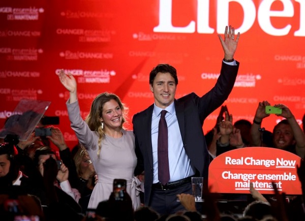 Liberal Party leader Justin Trudeau waves while accompanied by his wife Sophie Gregoire as he gives his victory speech after Canada's federal election in Montreal