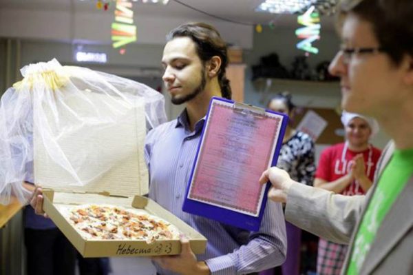 Pic shows: 22-year-old Russian marries a pizza.nnA lonely Russian gourmet fed up of not having a better half has married a pizza.nnThe bizarre wedding ceremony took place in a pizzeria in the city of Tomsk, in the Tomsk Oblast region that is located in south-central Russia.nnThe man who was not named said he came up with the idea because she was fed up of being alone.nnHe said: "At some point I realized that half of my friends are complaining about their better half, while the others were complaining about the lack of a better half."nn"Love between two humans is a complicated wild thing. I was grateful that I had at least my love of food and then it came to me that actually love for food remains stable no matter what."nn"Pizza would not reject you or betray you, and speaking quite frankly and sincerely, I love it."nnSceptical Russian authorities refused to give official permission to register the unusual marriage at a registry office, and the church also turned him down.nnSo in the end the unusual ceremony went ahead in one of the city¿s pizzerias. Managers and cooks at the restaurant even went as far as to provide the man with a certificate of marriage, and the pizza bride was covered in a bridal veil.nnAfter that the happy groom posed in front of many cameras with his "wife". Details of what they did on their honeymoon night together were not revealed.nn(ends)