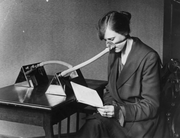 27th February 1919:  A woman wearing a flu mask during the flu epidemic which followed the First World War.  (Photo by Topical Press Agency/Getty Images)