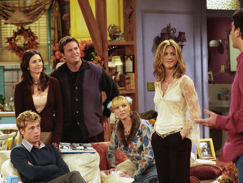 Brad Pitt, front left, joins the cast of NBC's television show "Friends" as a mystery guest on their Thanksgiving episode to air Thursday, Nov. 22, 2001. Cast members, from left, Courteney Cox Arquette, Matthew Perry, Lisa Kudrow and Jennifer Aniston, look at David Schwimmer, right. (AP Photo/NBCMV/Warner Bros., Danny Feld)   Original Filename: FRIENDS_THANKSGIVING_WXS105.jpg