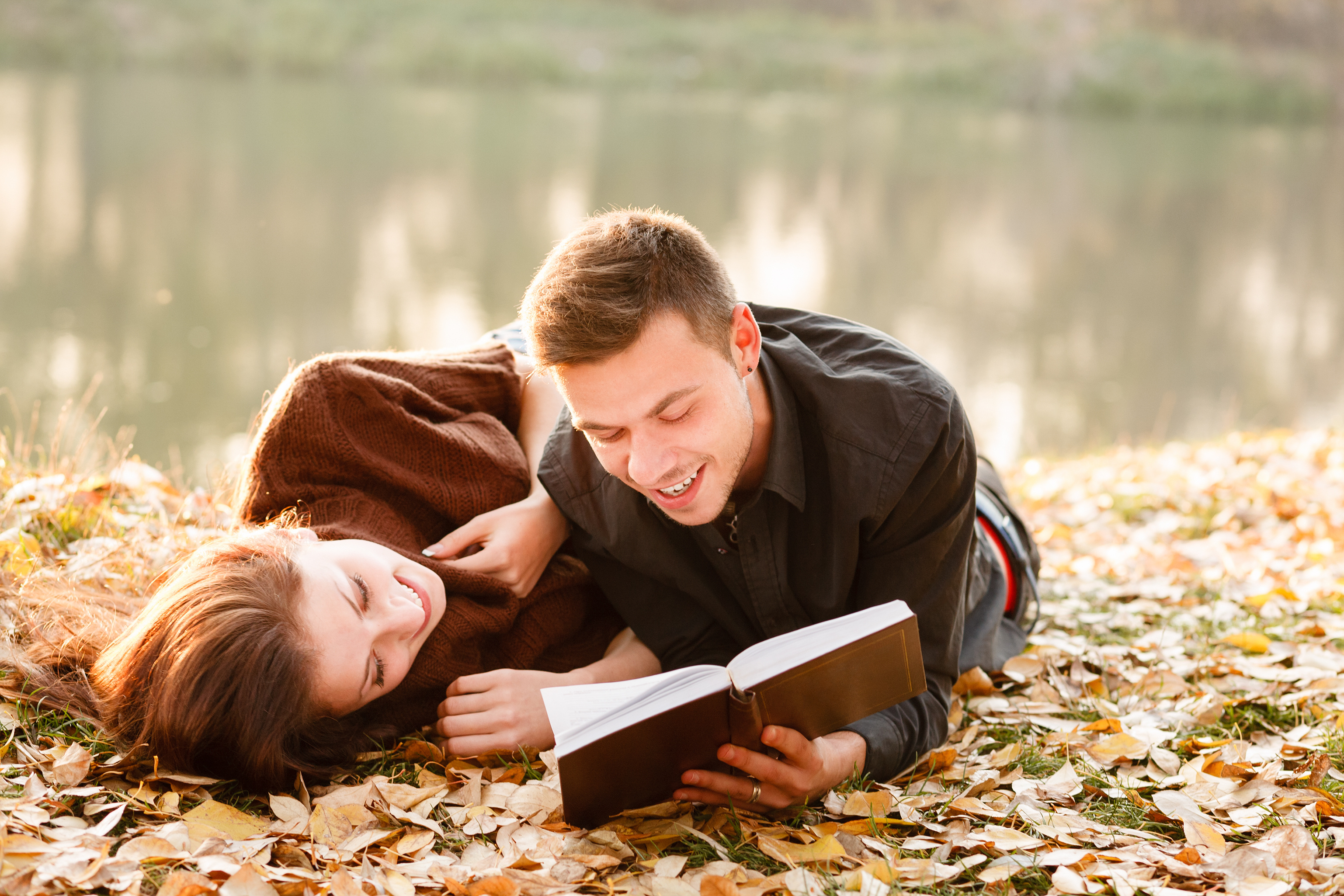 young man reading to his girlfriend