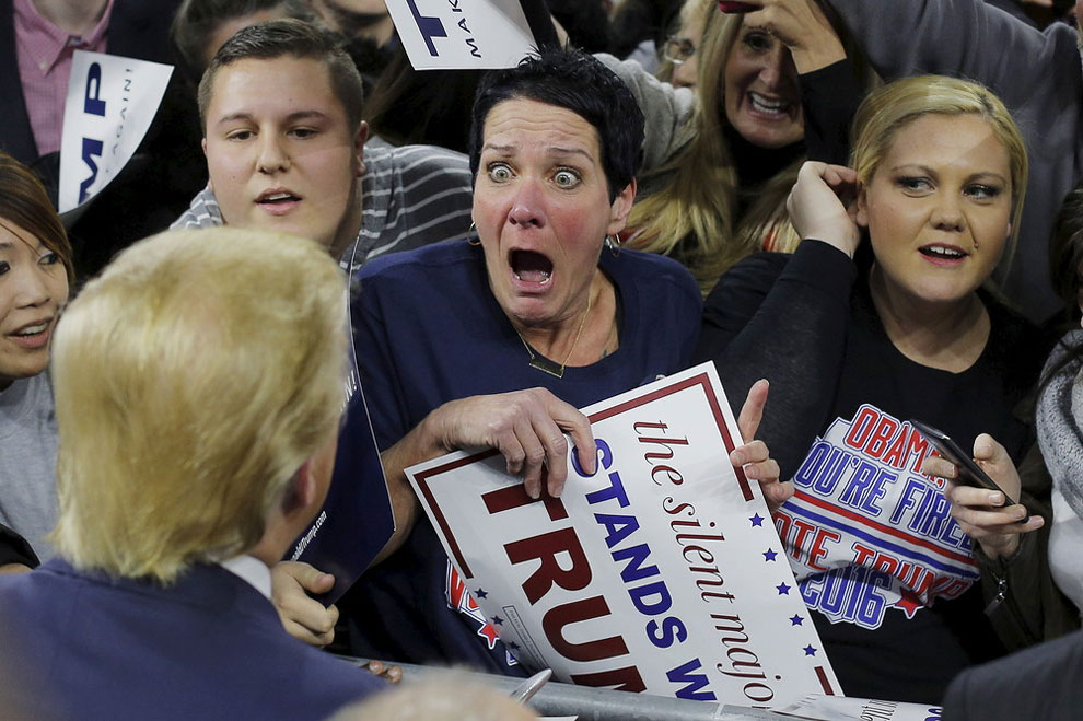 Audience member Robin Roy (C) reacts as Donald Trump greets her at a campaign rally in Lowell, Massachusetts January 4, 2016.
