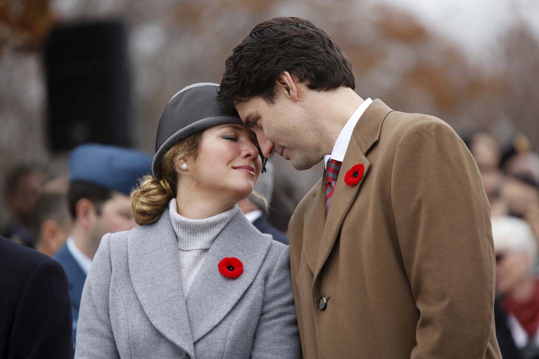 Canada's PM Trudeau and his wife Sophie share a moment during Remembrance Day ceremonies at the National War Memorial in Ottawa