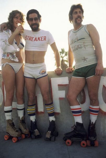 LOS ANGELES - DECEMBER 28:   A woman and two men taking a break from roller skating on December 28, 1979 in Venice Beach, CA. (Photo by Waring Abbott/Getty Images)