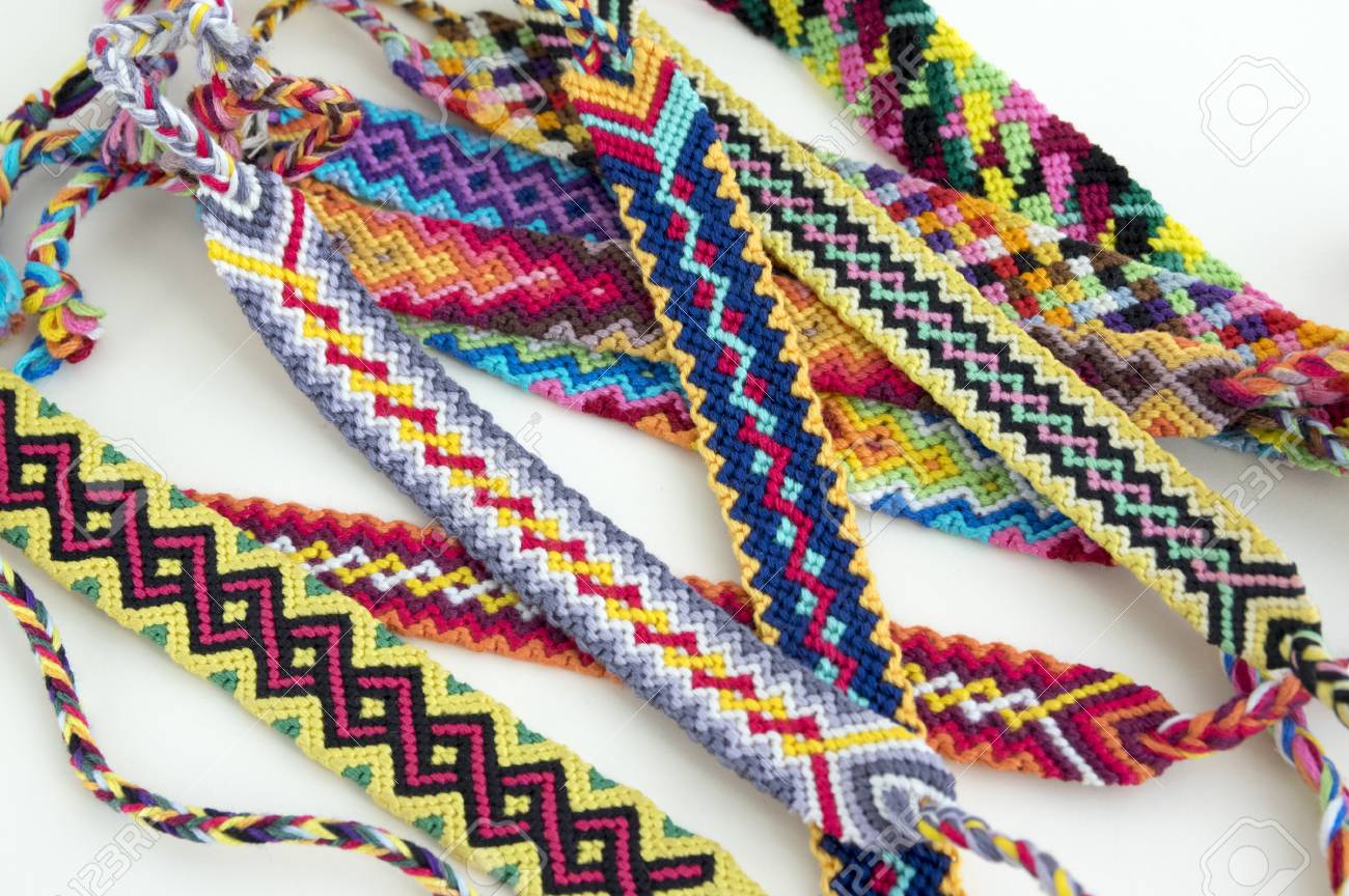 83154774-handmade-natural-bracelets-of-friendship-in-a-row-colorful-woven-friendship-bracelets-background-rai.jpg
